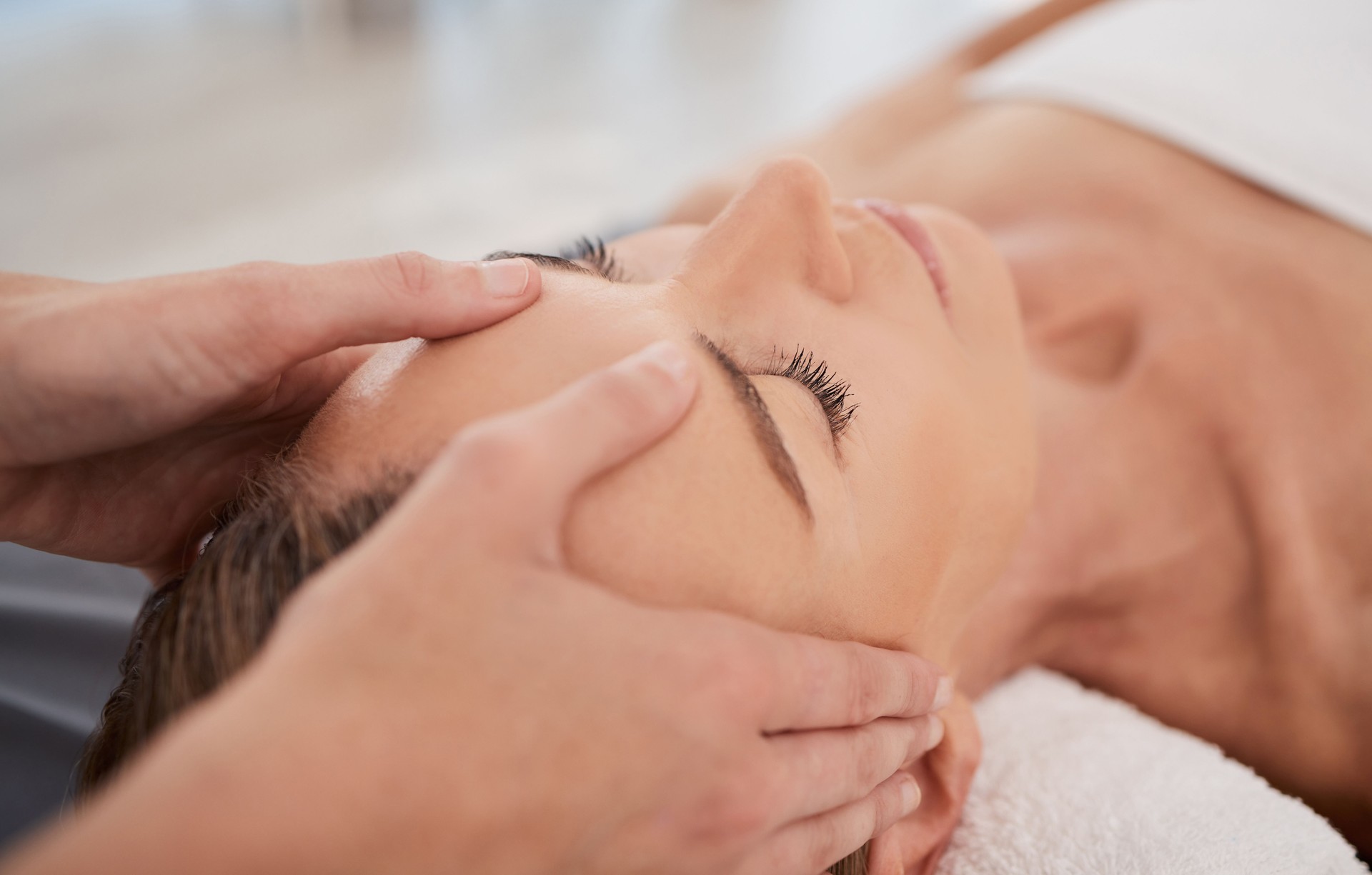 Closeup shot of a mature woman enjoying a relaxing head massage at a spa Closeup shot of a mature woman enjoying a relaxing head massage at a spa